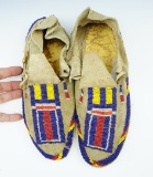 Nicely beaded pair of leather Moccasins. Only a few missing beads, 10