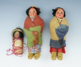 Set of 3 Skookum Dolls including a baby on a cradle board that measures 3 1/2