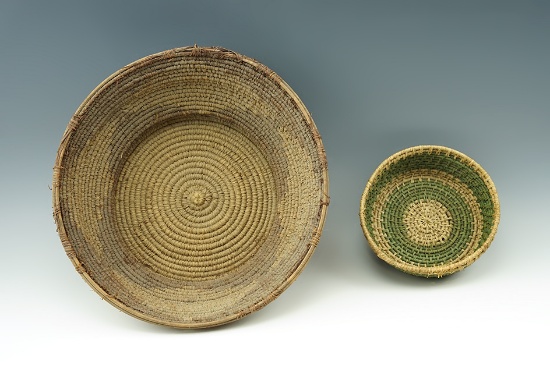 Pair of vintage woven baskets. Largest is 9 1/2" diameter.