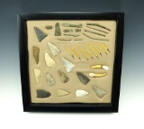 Set of assorted artifacts including points, copper artifacts, teeth and more.