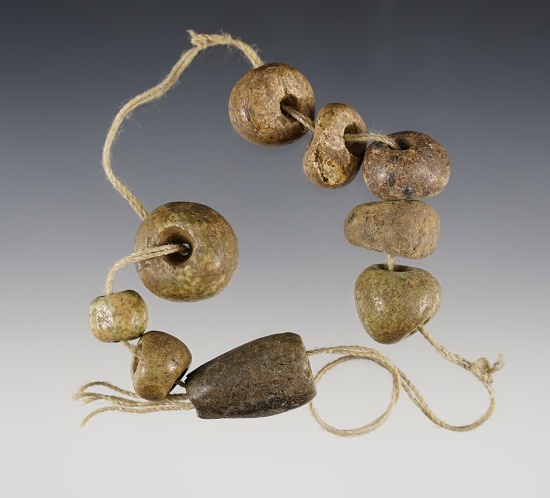 Strand of 9 drilled Mescala Beads found in Guerrero, Mexico. Ex. Len Weidner collection. COA.