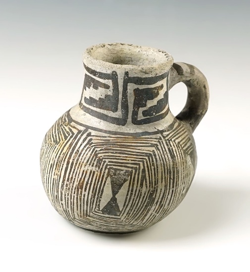 2 3/4" tall x 3" wide Miniature Anasazi Handled Pitcher with some restoration to handle area.