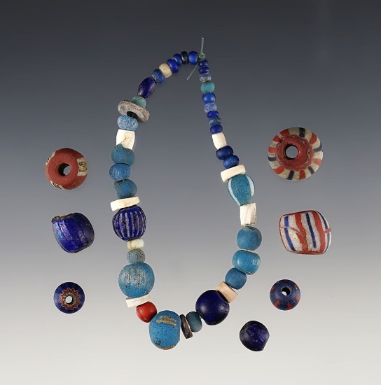 6 1/2" Strand and 7 assorted beads found at the Genoa Fort Site in Genoa, New York.