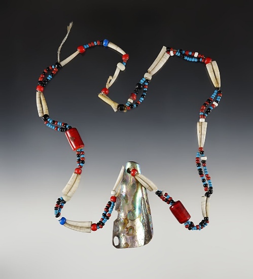 Nice strand of shell and glass beads that are nicely strung with a mother of pearl Pendant.