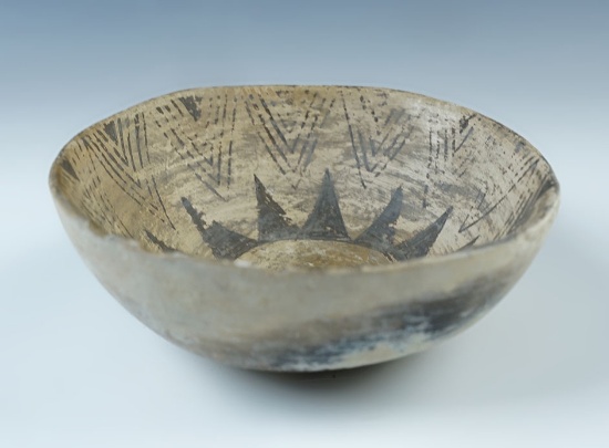 5 1/2" wide x 1 7/8" tall Anasazi Bowl with nice interior paint. A few rim chips, solid condittion.