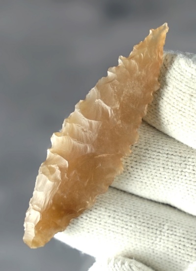 Outstanding 2 3/8" Serrated Leaf Point made from translucent material. Found in New Mexico.