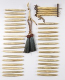 Set of 36 Bone Hair Pipe Beads with some original leather attachment and drops remaining.