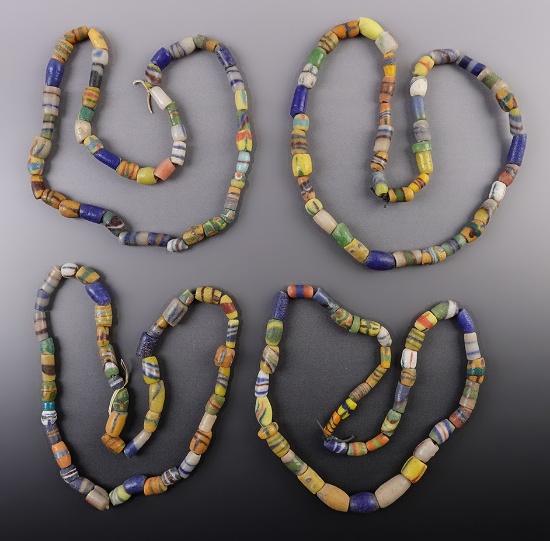 Exceptional color on this group of 4 strands of African Sand Cast Trade Beads. Circa 1890 - 1940.