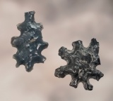 Pair of Obsidian Eccentrics. Larger is 15/16