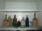 Shelf Lot of Colored Bottles and Jars