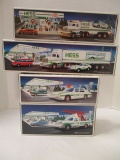 Hess 1991 Toy Truck and Racer, 1992 18 Wheeler and Racer, 1993 Patrol Car and 1994 Rescue Truck