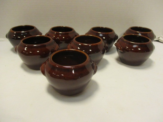 Eight Small Brown Pottery Crocks