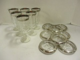 Eight Silverplated Rimmed Glass Coasters and Six Silver Striped Wine Glasses
