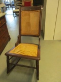Antique Rocking Chair with Cane Back and Bottom