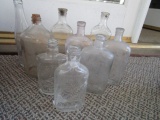 Nine Vintage Clear Glass Bottles