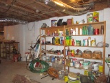 Two Sets of Wooden Shelves Against Wall with Contents