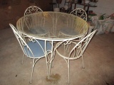 Metal and Glass Round Patio Table and Four Chairs