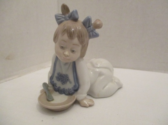 Lladro NAO Small Girl in Pajamas with Dish and Spoon