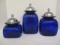 Three Blue Glass Canisters with Metal Lids
