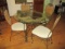 Round Glass Top Metal and Woven Table and Four Chairs