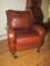 Burgundy Leather Chair with Nail head Trim and Casters