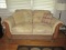 Upholstered Loveseat with Wood Accents and Accent Pillows