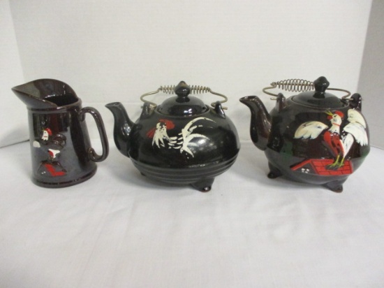 Two Rooster Teapots and Creamer