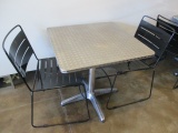 Table and Two Metal Chairs