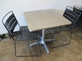 Table and Two Metal Chairs