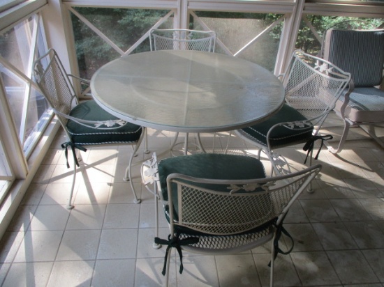 Round Metal Frame Table with Pebble Glass Top and Four Metal Mesh Chairs