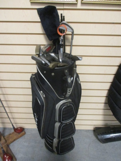 Black Taylor Made Canvas Golf Bag with Various Putters