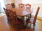 Oak Finish Dining Table with Leaf, Five Side Chairs and Arm Chair