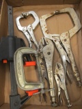 Four Vise-Grips, Metal C-Clamp and Quick Clamp
