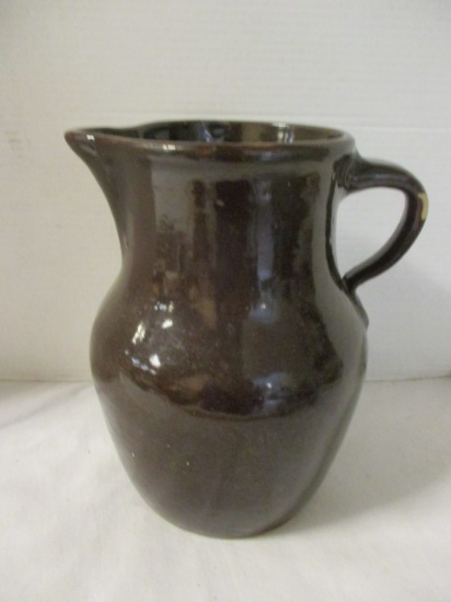 Brown Pottery Pitcher with Applied Handle