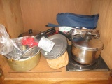 Contents of Two Cabinets - Pots and Pans, Baking Pans, Steak Plates. Trays, Cookie Cutters
