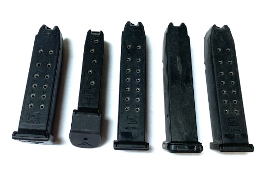 (4) Assorted Factory Glock 9mm Magazines & (1) Magpul Magazine