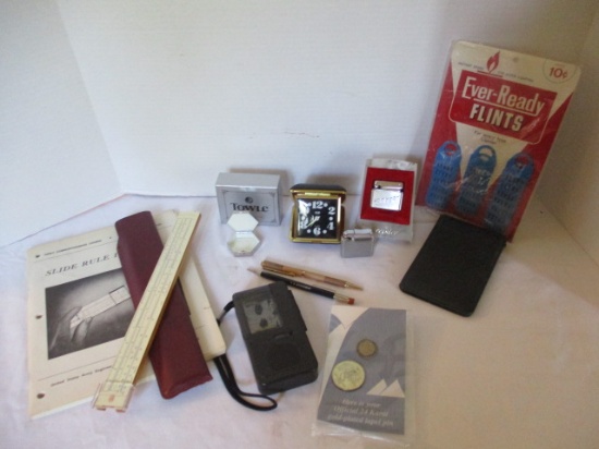 Towle Pill Box, Elgin Travel Clock, Kreisler and Colibri Lighters, Flints, Slide Rule, Mini Cassette