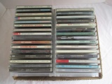 Various Genre Music CDs in Storage Stands