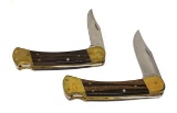 Pair of BUCK 110 Hunter Lockback Pocket Knives