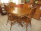 Oak Pedestal Table with Four Carved Back Chairs