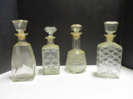 Four Clear Glass Decanters
