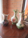 Three Porcelain Ewer Pitchers with Floral Motif