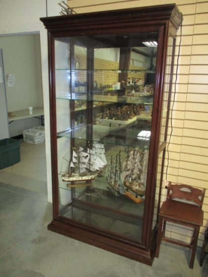 Lighted Curio With Glass Shelves and Sliding Door