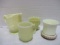 Four Pieces of Custard Uranium Glass Cups and Creamer