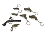 Lot of (5) Keychain Pocket Knives and (2) Miniature Cap Guns