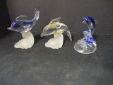 3 Glass Playful Dolphins riding wave