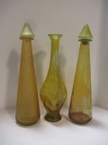 Three Midcentury Yellow Glass Bottles