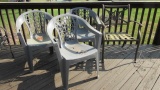 Three Heavy Duty Plastic Stacking Chairs and Cast Aluminum Arm Chair