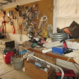 Contents of Garage Left Wall-Foot Lockers, Gas Cans, Scrap Lumber, Mechanic Seat,