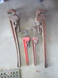 Four Large Pipe Wrenches